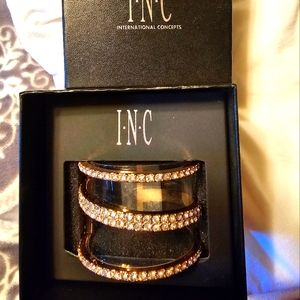 Inc rhinestone wrap cuff bracelet. Clear between the stones.